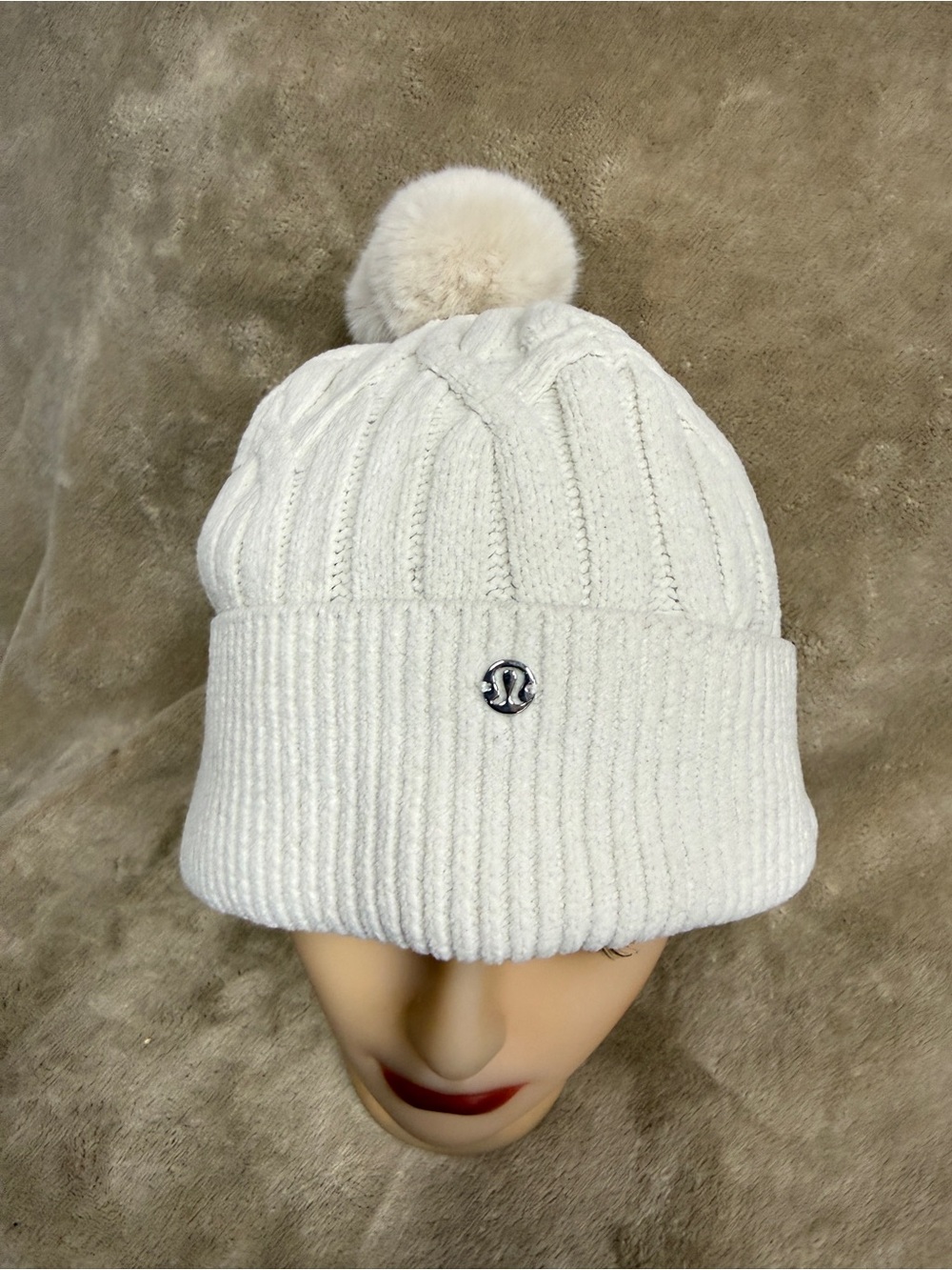 Lululemon beanie hat with pom-pom cream color